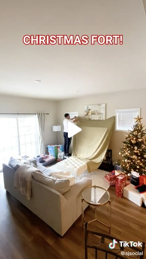 home living room fort during the holidays. Video on tiktok Living Room Tents Blanket Forts, Pillow Fort For Adults, Fort Ideas Indoor Living Rooms, Sheet Fort Indoor, Couch Fort Ideas Living Rooms, Christmas Fort Ideas, Fort In Living Room, Fort Ideas Indoor Easy For Kids, Living Room Fort Movie Nights