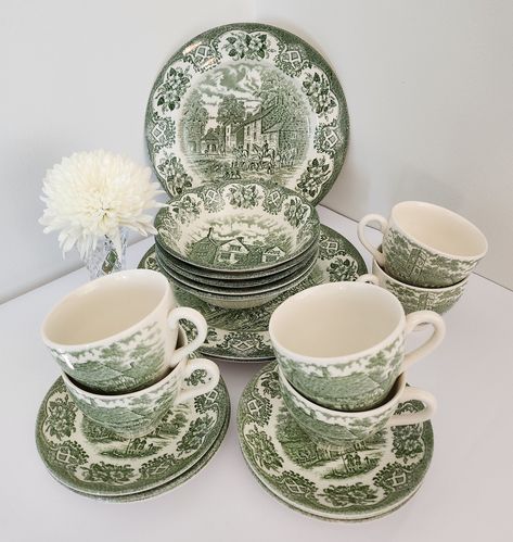 These beautiful vintage English Ironstone Tableware Ltd replacement pieces are white with green "Inn Series" country life transferware images. In good pre-owned condition except for one dinner plate which has a scratch, and one cup with marks on the inside (see photos). Pieces sold individually: 5x Soup Bowls 16cm dia. 3x Dinner Plates 24cm dia. 2x Side Plates 17.5cm dia. 5x Teacups 9cm dia. 6x Saucers 14cm dia. A lovely addition to any collection or perfect for adding a touch of retro elegance Green Vintage Dishes, English Country Tablescapes, Green Plates Dinnerware, Green Transferware Dishes, Cute Dishware, Green Plates Table Setting, Green Tableware, Green Dishes, Green Transferware