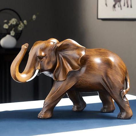 PRICES MAY VARY. -Elegant Elephant Statues — The lovely elephant statues are the perfect way to add warmth and beauty to your home décor with beautiful wood finishes and breathtakingly intricate details – making any space even more refined and charming! -Handcrafted from high quality resin — Handcrafted from resin material with a vintage finish wood grain, this elephant sculpture will provide the perfect sense of beauty and luxury in any space it is placed in! -Stylish elephant feng shui — adds Feng Shui Decoration, Rosewood Color, Unique Flower Vases, Elephant Home Decor, Simple Living Room Decor, Ceramic Sculpture Figurative, Side Table Decor, Clothes Organization Diy, Wooden Elephant