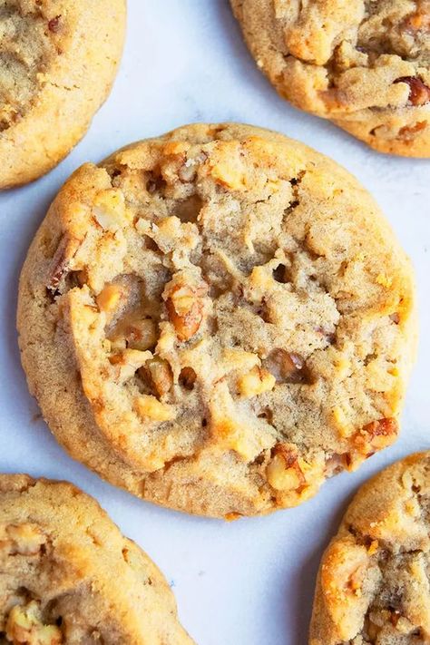 Butter pecan cookies via Cake Whiz. Soft, chewy cookies, loaded with toasted pecans and toffee bits. #butterpecan #butterpecancookies #cookierecipe Mary Makes It Easy Chocolate Pecan Cookies, Pecan Brittle Cookies, Butter Pecan Pudding Cookies, Pecan Devine Cookies, 12 Tomatoes Butter Pecan Fudge, Oatmeal Cookies With Pecans, Tall Cookies Recipe, Butter Pecan Toffee Cookies, Soft Chewy Christmas Cookies