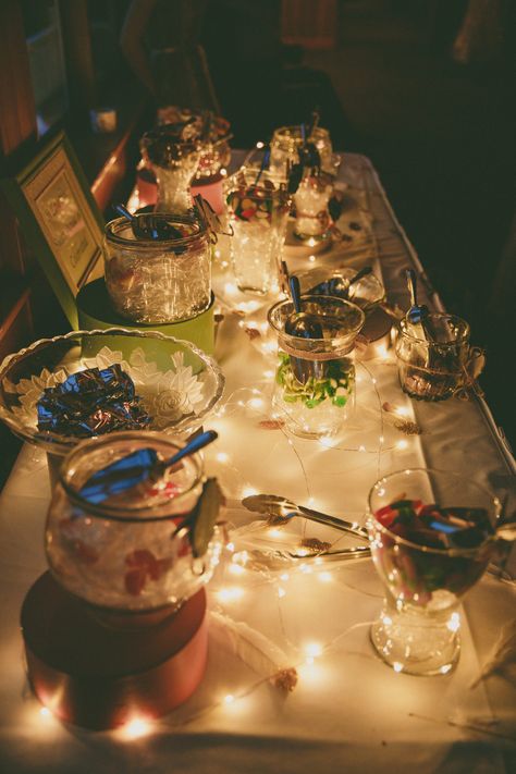 Candy table with fairy lights Table With Fairy Lights, Fairy Snacks, Prom Food, Outside Birthday, Sweet Table Wedding, Fairy Lights Decor, String Lights Party, Fairy Festival