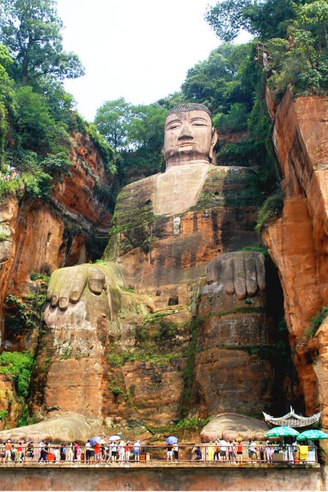 Standing a whopping 71-meters-high, Leshan Giant Buddha is the world’s largest Buddha sculpture and one of the most popular tourist attractions in China. Leshan Giant Buddha, Underrated Travel Destinations, Giant Buddha, Buddha Sculpture, Chinese Landscape, Travel Wishlist, Tourist Spots, Chengdu, Vacation Packages