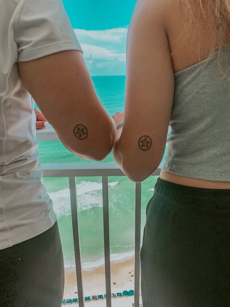 Sanddollar Tattoo Simple, Best Friend Sea Shell Tattoo, Island Vibe Tattoo, Beach Best Friend Tattoos, Tiny Sand Dollar Tattoo, Sand Dollar Tattoo For Women, Beachy Matching Tattoos, Small Sand Dollar Tattoo, Simple Sand Dollar Tattoo