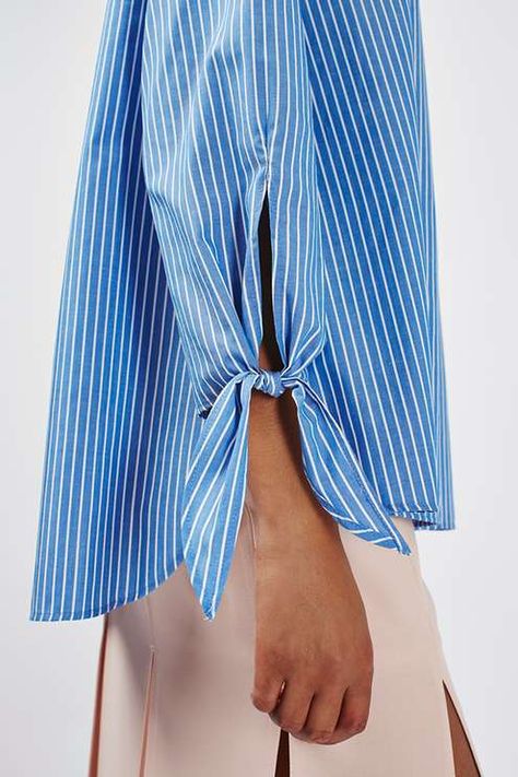 Leave shoulders bare in this oversized off-the-shoulder blouse. Finished with a striped pattern and tie detail to the sleeves, opt for clean lines on your bottom half for on-trend chic. #Topshop Detail Couture, Stripe Blouse, Clothing Details, Tie Sleeve, Sleeve Detail, Striped Blouse, Fashion Details, Batik, Off The Shoulder