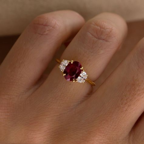 Falling in Love with rubies? This ring is available online ♥️♥️ Moonlight Setting 1.42ct Ruby Oval cut 18k Recycled Gold £5,760 with VAT Available Online #rubyring #engagementring #redruby #rubyengagementring #uniquering #engaged 3 Stone Ruby And Diamond Ring, Single Ruby Ring, Vintage Engagement Rings Ruby, Engagement Rings Moon, Diamond And Ruby Engagement Rings, Art Deco Engagement Ring Ruby, Engagement Rings Ruby, Ruby Ring Designs, Ruby Engagement Rings