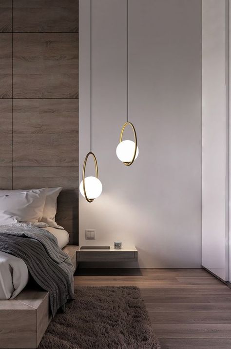 Friday design inspo – bedside pendant lights Hanging pendant lamps bring a little bit of class and style to your bedroom. No need for ornaments with these beauties, they do all the heavy lifting with their simple metal design and practical lights to read by. Image via Pinterest Bedside Pendant Lights, Modern Bedroom Lighting, Beautiful Bedroom Designs, Bedroom Pendant, Lights Hanging, Modern Inspiration, Bedroom Light Fixtures, Bedroom Wall Designs, Bedroom Decor Design