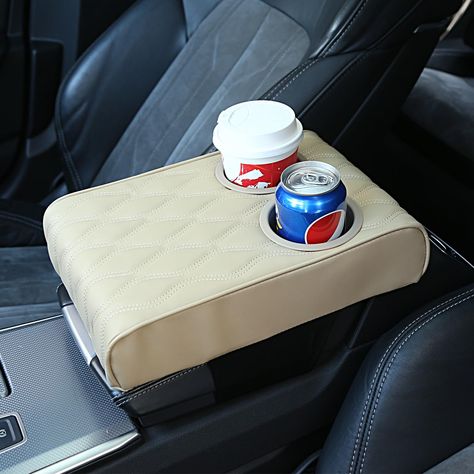 PRICES MAY VARY. 【New design】: Car Armrest Cushion with Cup Holder(3.14 Inch).Family and friends use cup holders for coffee, drinks, water cups,They will enjoy riding in your car. 【Dimension】:Car Armrest Cover(12.5*8.6*2.75 Inch) which fits the center console of most vehicles, SUVs, trucks, cars, vans, cars . Before placing an order, you should measure your car console before making a decision. 【High Quality】: Automobile armrest cover is made of high-quality micro fiber leather, which is very th Car Console Cover, Amazon Car Must Haves, Car Must Haves, Clean Car Mats, Must Have Car Accessories, Amazon Items, New Car Accessories, Car Console, Car Armrest