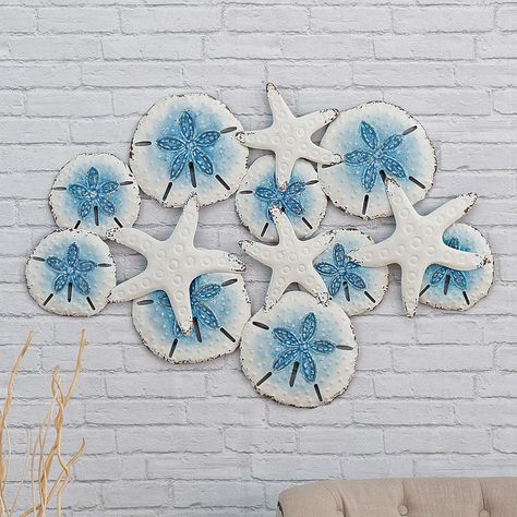 PRICES MAY VARY. 60 Day No Hassle Returns A Bella Coastal Decor Exclusive - An array of metal starfish and sand dollars accented in hues of blue. 35"W x 1 3/5"D x 23 4/5"H Oyster Shells Decor, Buffalo Wall Art, Beach Wall Hanging, Seaside Home Decor, Clay Fish, Black Forest Decor, Hues Of Blue, Sea Decor, Forest Decor