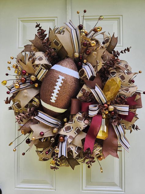 This Football Wreath will look amazing hanging on your door or on your wall! This Grapevine Wreath will be a perfect gift for someone or even a special treat to yourself! Just imagine how many of your guests will be in awe of this Football Wreath. Best places to be used: It is weather resistant outdoors but please move inside in extreme weather conditions. Colors: Brown, White and Burgundy If this one of a kind Football Wreath isn't the perfect fit check out the other related products in my shop Football Themed Wreaths, Diy Football Wreaths For Front Door, Cleveland Browns Wreath, Cute Wreaths, Football Wreaths For Front Door, Fall Grapevine Wreath Ideas, Dollar Tree Wreath Ideas, Thanksgiving Wreaths For Front Door, Football Wreath Diy