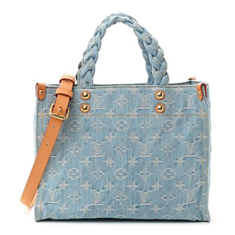 LOUIS VUITTON Monogram Washed Denim Let Go PM in Sky Blue. This bagis crafted of classic Louis Vuitton monogram stitched in denim fabric. The bag features denim top handles, an optional leather shoulder strap, polished gold hardware. The top opens to a matching denim interior. Washed Denim, Denim Top, Denim Fabric, Let Go, Denim Wash, Louis Vuitton Monogram, Gold Hardware, Sky Blue, Letting Go