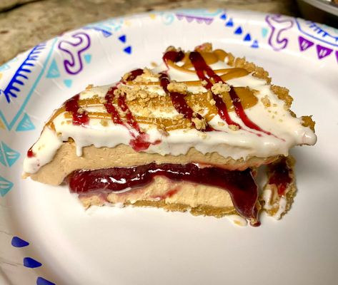 This chilled, no-bake pie will take you back to those peanut butter and jelly sandwiches of your childhood and will be the hit of any meal, party, or celebration. Peanut Butter And Jelly Pie, Jelly Cheesecake, Light Soup, Peanut Butter Jelly Time, Jelly Desserts, Pie Shop, Chocolate Graham Crackers, Peanut Butter Filling, Peanut Butter Pie