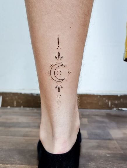 Uncover the intriguing meaning behind the Crescent Moon tattoo with an array of stunning images to spark your imagination. #tattooinspiration #CrescentMoon #tattoomeaning Tri Moon Tattoo, Crescent Moon Tattoo Sternum, Half Crescent Moon Tattoo, Moon Tattoo With Quote, Unalome With Moon Tattoo, Moon Tattoo Mandala, Crescent Moon Star Tattoo, Half Moon Tattoo Designs For Women, Half Moon Tattoo Meaning