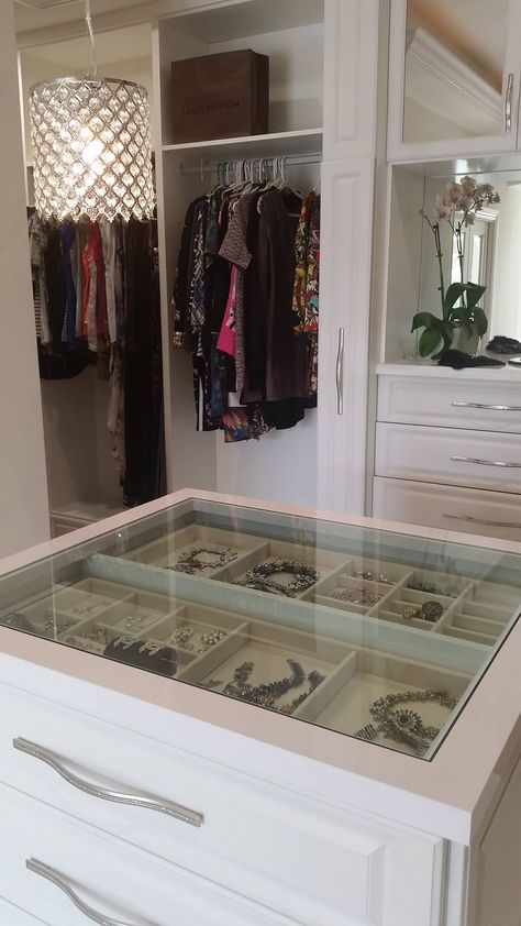 A see through center island counter top, allowing you to view your precious jewelry at a glance.    Designed by Senior Designer Jeanne Hessen  Learn more: https://www.closetfactory.com/custom-closets/ Closet Island Jewelry Drawers, Closet Island Glass Top, Center Closet Island, Walk In Closet Center Island, Glass Top Jewelry Drawer, Closet Island With Jewelry Storage, Closet Island With Glass Top, Jewelry Island In Closet, Closet Center Island