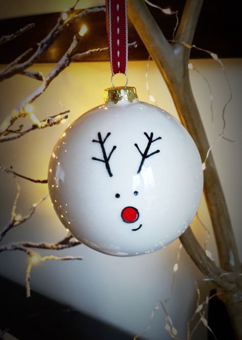 'Rudolph' personalised ceramic bauble hung on gorgeous festive ribbon.  Large £15 and small £12 from our website www.artypantsceramics.co.uk/shop Make Your Own Christmas Baubles, Bauble Design Ideas, Pottery Painting Christmas Baubles, Painting Baubles Christmas, Easy Bauble Painting Ideas, Christmas Bauble Designs, Christmas Ball Painting Ideas, Xmas Baubles Diy, Ornament Painting Ideas Ball