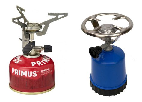 Two different types of gas camping stoves. The left stove has a screw-on gas can.  The right stove uses a puncture (pierce) style gas canister. Primus Stove, Stove Board, Gas Canister, Backpacking Essentials, Backpacking Stove, Camping Gas, Best Tents For Camping, Waterproof Matches, Best Camping Gear