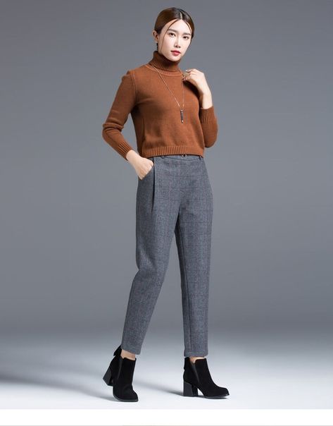 "These pants showcase a timeless blend of style and warmth. The classic plaid pattern adds a touch of sophistication, while the high-quality wool fabric ensures both comfort and coziness. DETAIL * 60% wool, 40% polyester * Two side pockets * Front button and zipper closure * Tapered pants * High waisted Pants * Has belt loops to keep everything in place * Perfect for autumn and winter * Dry-clean Mode size Waist 26\"(66cm) Heigth 5'7\"(167cm) She wears the size XS Choose CUSTOM Order if you * Need a better fit * Can't find your size in our size Chart * Chang the Length * Your Height is not Between 5'1\" - 5\"9\" * Your weight is not from 47 kg to 75 kg SIZE GUIDE Size vary between Brand and Country Please get your body measurement with our Size Guide And Find your size in our Size Chart SI Womens Wool Trousers, Autumn Pants, Fall Pants, Pants High Waisted, Body Measurement, Pants Womens, Wool Trousers, Tapered Pants, Wool Pants