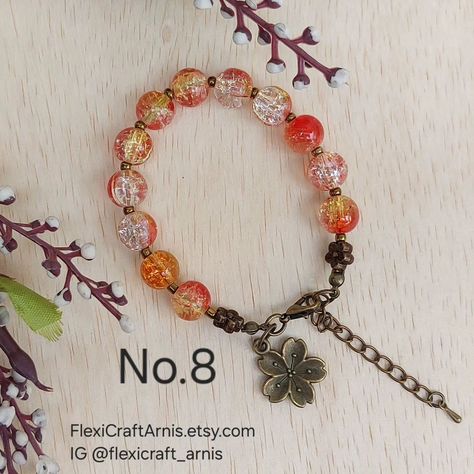 FALL AUTUMN beaded bracelet No.8 10mm crackle glass beads Spacer using 3mm bronze color glass seed beads. Measurement: 7 inch + 2 inch extender chain (adjustable) Buy from my Etsy shop: https://flexicraftarnis.etsy.com/listing/1794851842 #beading #beadedbracelets #beadedbracelet #glassbeads Crackle Glass, No 8, Glass Seed Beads, Bronze Color, Fall Autumn, Beaded Bracelet, Seed Beads, Beading, Glass Beads