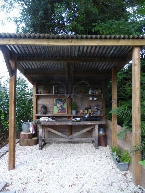 An outdoor kitchen for my man... love the painting of Clint!  Jacob Cottage UK Grill Patio, Bbq Shed, Rustic Outdoor Kitchens, Diy Outdoor Bar, Backyard Bar, Wooden Structure, Building Tips, Bbq Area, Cabin Ideas