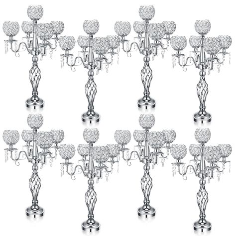 PRICES MAY VARY. Exquisite Material and Decorative Design: transform your living space with these 8 pcs 5 arm crystal candelabra centerpieces, crafted from crystal material; Not just beautiful to look at, these candelabras feature an intricate hollow carving design and octagonal crystal bead shape that distinguishes them from regular centerpieces Luxurious Hues: imbued with a sophisticated silver color, this 5 arm crystal candelabra is perfect for those who appreciate silver touch to their home Victorian Centerpieces Wedding, Xmas Wedding Decorations, Silver Centerpieces For Party, Winter Ball Decorations, Crystal Wedding Decorations, Christmas Dinner Centerpieces, Silver Centerpieces, Elegant Wedding Decorations, Candelabra Centerpieces