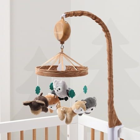 Whimsical Woodland Musical Mobile by The Peanutshell helps to promote baby's auditory development, motor skills and visual stimulation. Our thoughtfully designed nursery essential features a soft velour bear, deer, owl, moose and fox surrounded by green felt leaves and central white cloud. A faux woodgrain printed ring construction adds extra forest flair to your nursery. The digital music box plays snippets of 12 different lullabies to sooth your little one gently to sleep. Easily switch music Natural Baby Room, Forest Theme Nursery, Wilderness Nursery, Woodland Creatures Nursery, Printed Ring, Woodland Animals Nursery, Forest Animal Nursery, Whimsical Woodland, Owl Nursery