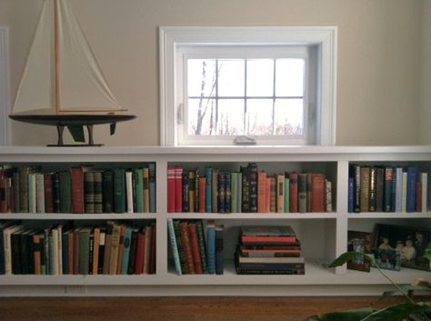 Built in bookcase under awning window Low Bookcase Under Window, Under Window Bookshelf, Awning Window, Kitchen Shelving, Future Office, High Windows, Low Bookcase, Transom Windows, Wooden Books