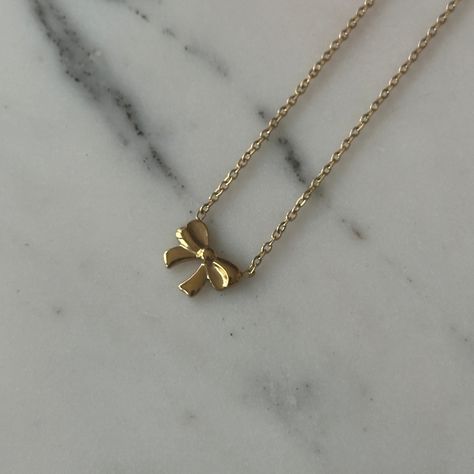 a small bow pendant on a dainty chain to give the perfect balletcore aesthetic. material: 18k gold plated on titanium steel, non tarnishing length: 40cm+5cm adjustable Balletcore Aesthetic, Bow Pendant, Preppy Jewelry, Crystal Heart Necklace, Bow Necklace, Jewelry Accessories Ideas, Dainty Chain, Girly Accessories, Jewelry Essentials