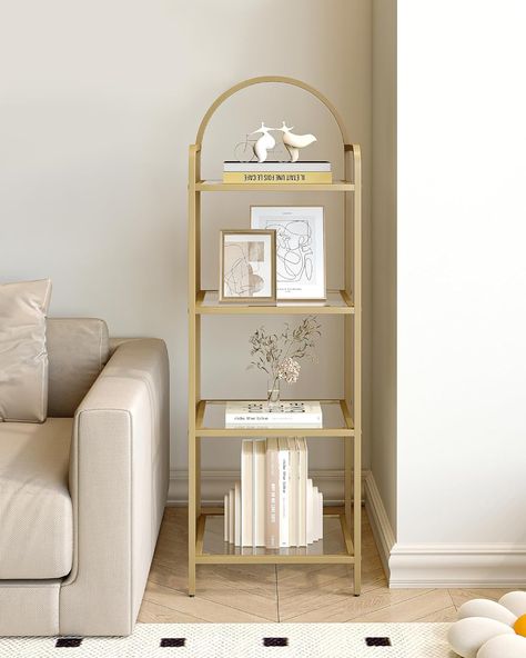 About this item Decorate Your Room: With transparent tempered glass shelves and a gold-colored frame, this 4-tier storage rack allows you to display your greenery, books, and collectibles while elevating the look of your space. The top oval design makes this bookcase unique and stylish,and helps to decorate your room Maximize Enough Space: Sized at 15.7"W x 11.8"D x 47.8"H, this book shelf takes up only little floor space but allows you to make full use of the vertical space for storage. Designed on both sides of the top to prevent items from falling Multifunctional 4-tier Rack: Need a bookcase for your books? Or a display rack for trinkets? Or a storage rack for photos in your bedroom? This 4-tier rack could meet your needs Glass Bookshelves, Steel Shelving Unit, Glass Bookcase, Steel Shelving, Office Bookcase, Cube Bookcase, Shelving Racks, Tempered Glass Shelves, Seasonal Home Decor