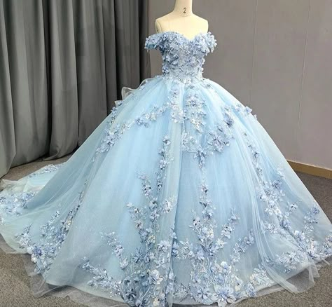 Indulge in the exquisite beauty of this Blue Princess Quinceanera Dress Ball Gown, adorned with 3D floral embellishments. The off-the-shoulder cuff sleeves and sweetheart bodice, adorned with pearls and flowers, create a captivating silhouette. The full ball gown skirt cascades with delicate floral details, while the lace-up back allows for a perfect, customizable fit. Own the moment in this truly stunning and luxurious gown. material: organza color: as shown type: party ball gown sweetheart neckline built in bra lace up back train as shown shown as size 2 original photos Blue Cinderella Quinceanera Dresses, Pink And Blue Quinceanera Dresses, Blue And White Quinceanera Dresses, 15 Dresses Blue, Light Blue Tulle Gown For Quinceanera, Princess Style Blue Quinceanera Ball Gown, Baby Blue Floral Quince Dresses, Pale Blue Princess Dress, Quinceanera Dresses Blue Quincedresses.com