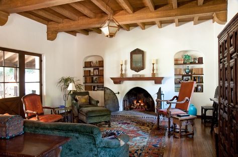 spanish living room, beamed ceiling, stucco fireplace, arched bookshelves, spanish colonial revival style Spanish Revival Decor, Spanish Style Living Room, Southwestern Homes, Spanish Living Room, Spanish Home Interior, Spanish Colonial Homes, Spanish Decor, Colonial Interior, Mediterranean Living