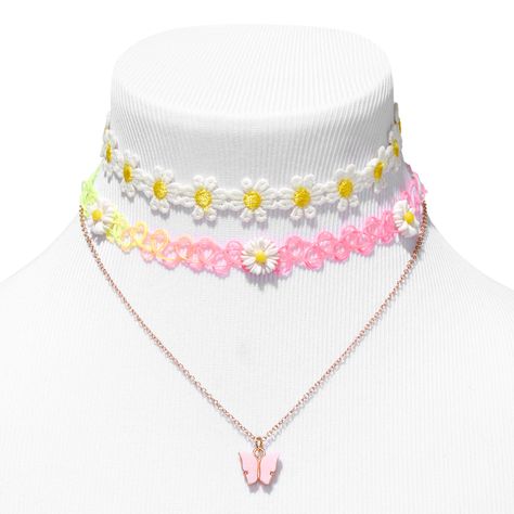 This three-pack necklace set is full of options you are sure to love. The set includes two daisy-embellished tattoo chokers and a pink pendant gold-tone necklace. Wear one or more for the layered look. Pack Size: 3 Finish: Gold-tone Length: 12" + 3" extender Closure: Lobster clasp Material: Metal, Plastic - Claire's Daisy Chokers & Pink Butterfly Pendant Necklaces (3 Pack) Chokers For Kids, Butterfly Clothes, Daisy Choker, Kawaii Necklace, Hello Kitty Gifts, Unicorn Outfit, Cute Birthday Gift, Kawaii Jewelry, Butterfly Pendant Necklace