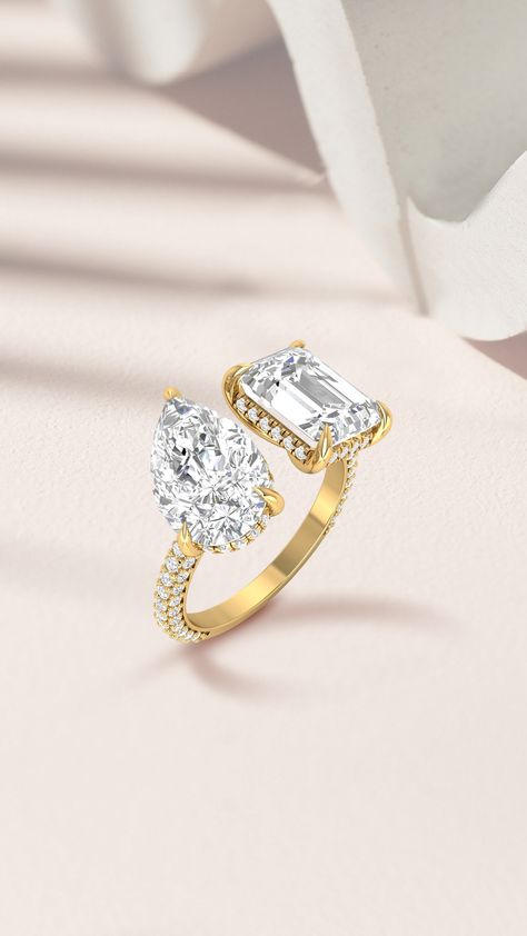 When you can't decide on just one shape, you go for a Toi et Moi ring! 💍 The two stones in this ring represent the union of two hearts. Would you choose a Toi et Moi ring as your engagement ring?❤️  #pearcut #emeraldcut #weddingring #pearcutdiamondring #emeraldcutring #twostonering #doublediamondring #yellowgoldring #deediamonds Two Stone Diamond Ring, Double Diamond Ring, Pear Cut Diamond Ring, Bridal Jewellery Inspiration, Stone Diamond Ring, Diamond Pendant Sets, Designer Bracelets, Elegant Engagement Rings, Solitaire Rings