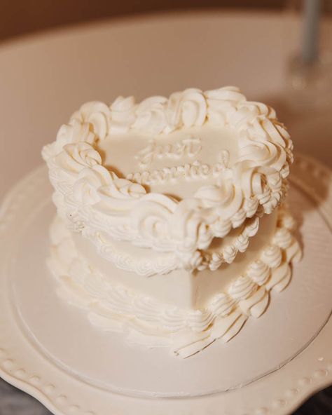 "She gave away the surprise when I caught her practicing getting down on one knee in the mirror as we headed out the door, but it was still the most magical moment of my life."⁠ ⁠ Oopsie!⁠ ⁠ Mackenzie (she/her) and Taylor (she/her) got married in California. The rain showered, the wind shattered their champagne tower, but they both have never felt more whole. ⁠ ⁠ "As we raised two of the only surviving champagne glasses and made a toast, we looked around the room at all our loved ones, soaked... Just Married Wedding Cake, Heart Shaped Wedding Cakes, Heart Wedding Cakes, San Clemente California, Wedding Cake Alternatives, Beachside Wedding, Engagement Stories, White Frosting, Modern Luxe