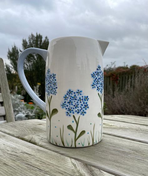 Water Jug Painting Ideas, Forget Me Not Pottery Painting, Milk Jug Painting Ideas, Painted Jug Ideas, Hand Painted Jug Ideas, Ceramic Hand Painting, Pottery Painted Vase, Paint Your Own Pottery Vase, Painted Pitcher Ideas