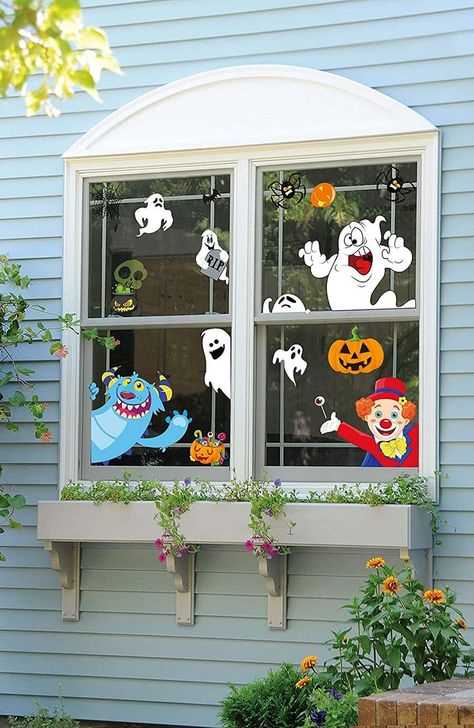 Halloween Window Decorations Ghosts, black cats, witches, skeletons, and monsters seem to be peeking and saying “HAPPY HALLOWEEN” to you during this spooky time. 
This image may contain a link to an affiliate website Door Halloween Decorations, Witch Skeleton, Refrigerator Doors, Halloween Window Clings, Black Cat Witch, Halloween Window, Halloween Door Decorations, Halloween Candles, Halloween Ornaments