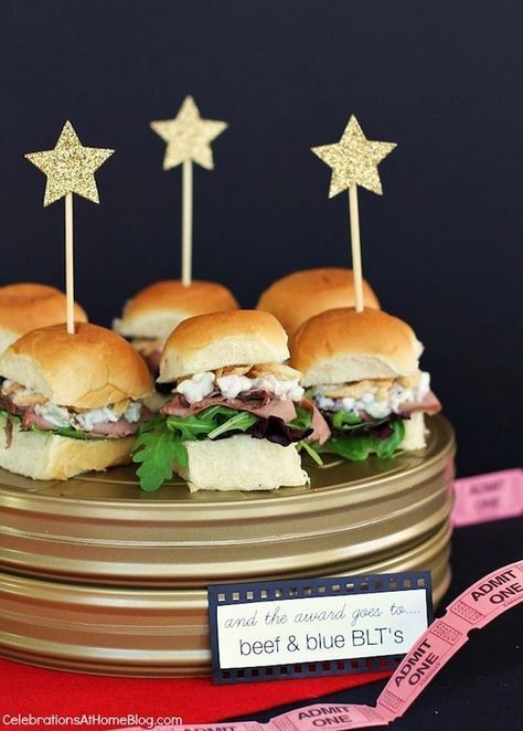 We love easy Oscar party food ideas, like these Roast Beef and Blue Cheese (or any kind of cheese) sliders. Just add little star toppers and poof! Your table is red carpet ready. | Celebrations at Home Oscar Party Food, Deco Cinema, Cinema Party, Cheese Burgers, Cheese Table, Hollywood Birthday, Cheese Sliders, Hollywood Party Theme, Red Carpet Party