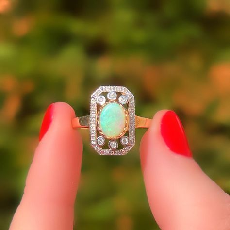 📸NEW PICS of this STUNNING Art Deco-inspired opal and diamond ring – it was time for an update! What do you think?💭 ❤️At the heart of this ring is a striking opal, set in a scalloped yellow gold bezel for a soft, elegant finish. 💎✨Surrounding the opal are shimmering diamonds of varying sizes, adding even more sparkle. Did you notice these diamonds are set in white gold? This contrast enhances their fire and brilliance, how clever?🤓 Currently, she is a UK size O but can be resized. Availa... Opal And Diamond Ring, Ring Art Deco, Art Deco Inspired, Opal Ring, Opal Rings, Diamond Ring, You Think, Opal, Art Deco