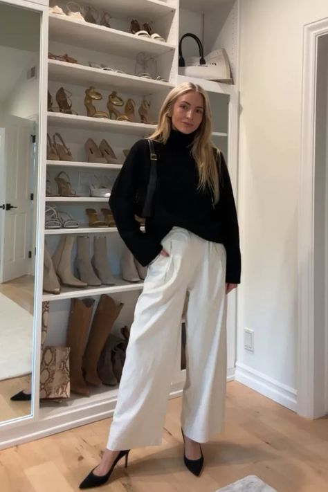 Repeating this chic black and white winter outfit all season 🖤 I styled this black cashmere turtleneck sweater with loose trousers and classic black heels. Tap to shop and bring this fashion inspo to life! White Turtleneck Outfit Work, Chic Turtleneck Outfit, Trouser And Sweater Outfit, Trousers And Heels Outfit Ideas, Loose Turtleneck Outfit, White Turtleneck Sweater Outfit, Black Cashmere Sweater Outfit, Turtle Neck Sweater Outfits, White Trousers Outfit Winter