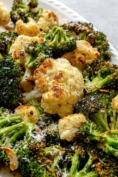 This easy sheet pan roasted broccoli and cauliflower with parmesan, breadcrumbs, and garlic is quick and delicious! #broccoli #cauliflower #sidedish #vegetables #vegetarian #Weightwatchers #healthyrecipes Pan Roasted Broccoli, Broccoli Cauliflower Recipes, Roasted Broccoli And Cauliflower, Roasted Broccoli Recipe, Delicious Broccoli, Broccoli Cauliflower Salad, Easy Vegetable Side Dishes, Broccoli And Cauliflower, Cauliflower Dishes