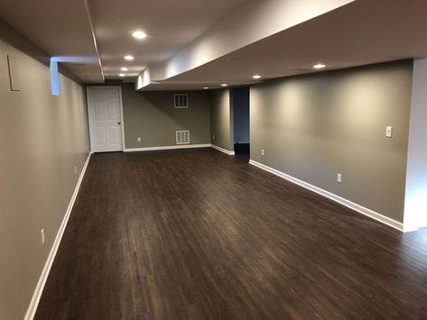 Finished Basement with Hardwood Floors | The Basic Basement Co. Basement With Dark Floors, Basement Hardwood Floors, Basement Dark Floors, Wood Basement, Small Finished Basement Ideas, Basement Color, Small Finished Basements, Brown Laminate Flooring, Gray Basement