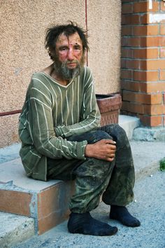 This image shows the dress of someone based on social and economic roles. The man imaged is less fortunate than others, and isnt in a financial space to provide himself the necessities needed, such as clothing and shoes. Man Stock Photo, Growth And Decay, Street Image, Desktop Background Pictures, Homeless People, City Street, Background Pictures, The Villain, Male Face