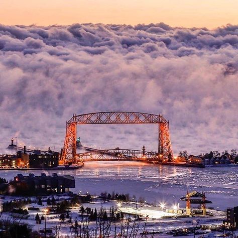 Amazing photo of sea smoke (fog) rising off of Lake Superior behind the Aerial Lift Bridge in Duluth, Minnesota, by (at)muddman4809 via Instagram. Lift Bridge, Minnesota Travel, Minnesota Home, Duluth Minnesota, Midwest Living, Duluth Mn, Michigan Travel, Amazing Photo, Natural Phenomena