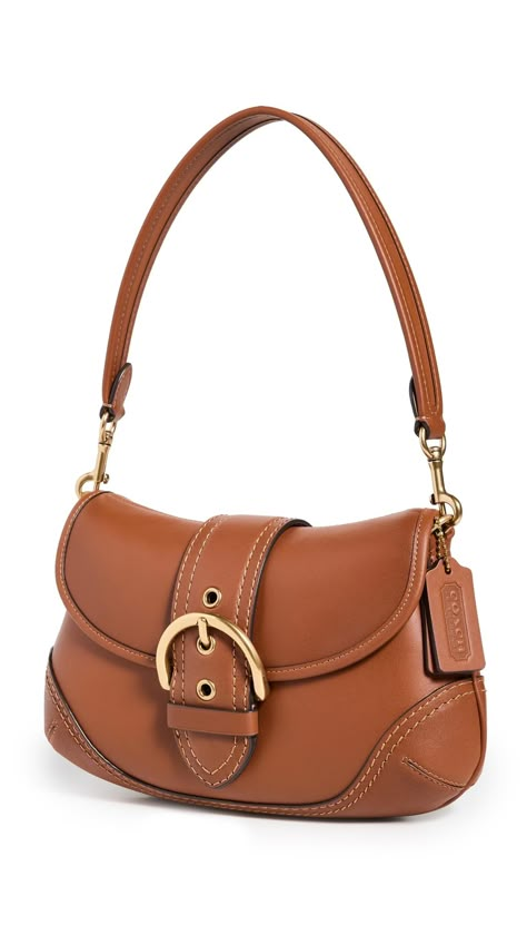 PRICES MAY VARY. Decorative buckle, Gold-tone hardware Length: 11in / 28cm, Height: 6.75in / 17cm, Handle drop: 7.75in / 20cm, Depth: 2.25in / 6cm Fold-over flap with magnetic snap Patch interior pockets Optional strap Glovetanned Soho Bag Rear Delt, Hand Bags For Women, Coach 1941, Buckle Bags, Bags Aesthetic, Purse Accessories, Cute Bags, Leather Hobo, Bracelet Patterns