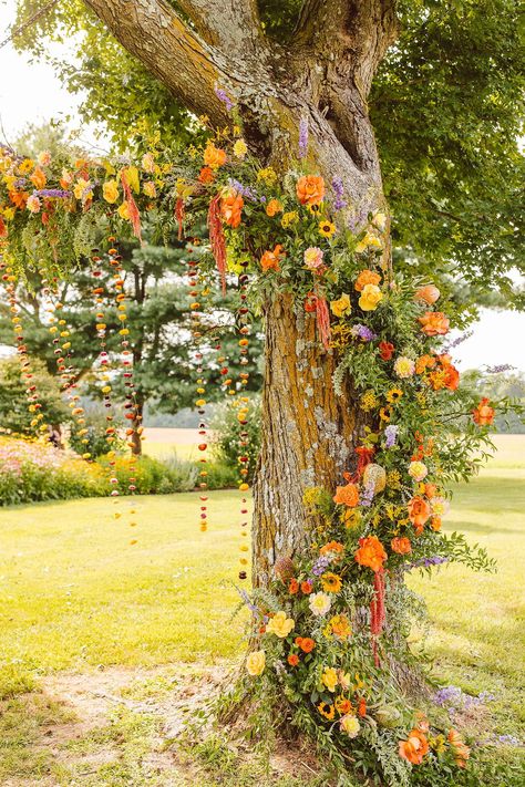 Colorful Boho Wedding Day Inspiration | Brooke Michelle Photo | Charlotte Wedding Photographer | wedding photographer, orange wedding palette, outdoor wedding, floral installation, flowers in tree | via brookemichellephoto.com Orange Tree Wedding, Orange Orchard Wedding, Outdoor Wedding Tree Decor, Summer Wedding Aisle Decor, Boho Wedding Arches, Eclectic Wedding Arch, Gazebo Flowers Wedding, Marigold Wedding Colors, Orange Wedding Aesthetic