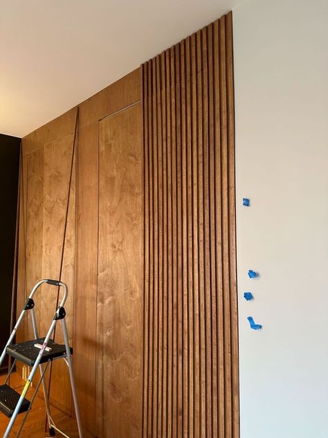 DIY slat wall with hidden doors - functional slat wall with hidden closet Wood Slat Hidden Storage, Wall Paneling Hidden Storage, Wooden Slat Cupboard Doors, Hidden Linen Closet, Wood Slat Wall Hallway, Wood Slat Wall Hidden Door Diy, Hidden Entry Closet, Hidden Slat Wall Door, Slatted Door Makeover