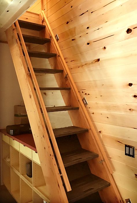 The nearly vertical incline of the staircase reminds one of a ship’s ladder. Ships Ladders Loft Stairs, Ship Ladder Stairs, Ship Ladder For Loft, Ships Ladder To Loft, Double Stairs, Ships Ladder, Loft Stairs Ideas, Stairway Storage, Ship Ladder