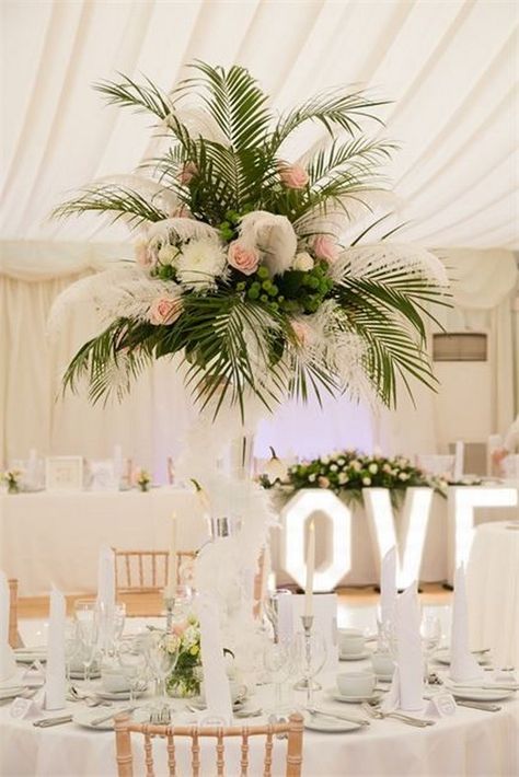 palm leaf tall wedding centerpiece / http://www.himisspuff.com/green-tropical-leaves-wedding-ideas/2/ Palm Leaf Centerpiece, Greenery Wedding Centerpieces, Tall Wedding Centerpieces, Tall Centerpieces, Wedding Leaves, Classy Wedding, Wedding Table Centerpieces, Tropical Wedding, Greenery Wedding