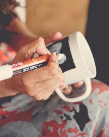 If even the mention of a "shower game," makes the bride cringe, a good alternative is a hands-on craft for partygoers. These DIY chalk coffee mugs played three parts in one shower: Guests created them as the activity (or "game"), sipped coffee (spiked with Bailey's!) from them while noshing on donuts, and took them home as favors. Bridal Shower Activities Crafts, Bachelorette Party Crafts Activities, Bridal Shower Crafts Activity, Bachelorette Craft Activities, Bridal Shower Ideas Diy, Bridal Brunch Favors, Bridal Shower Crafts, Embellished Hats, Chalkboard Coffee