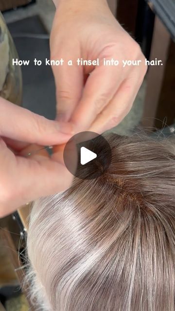 WhiteRock " Master Hairstylist" on Instagram: "“Add a touch of sparkle to your hair with this easy tinsel knot technique! ✨ 

Tinsel installation steps:

1.	Take one tinsel and fold it in half.
2.	Create a loop and pull one strand of hair through the loop. Use a very small strand of hair, maybe three single hairs.
3.	Make a knot between the hair and the tinsel.
4.	Take the two tinsel strands and do two double knots.

And that’s it!

“Please follow, like, save, and share if you love this look! Your support means the world to us. ❤️🙏”

#tinselhair #hairtutorial #hairhowto #whiterockhaircut #whiterockbchairstylist #hairsparkle #hairaccessories #funhair #hairfashion #hairstyles #stardustmagic #hairtinsels" Sparkle Strands In Hair, How To Do Tinsel In Hair, How To Tie Hair Tinsel In Hair, Hair Tinsel Slip Knot, Tinsels In Brown Hair, Hair Tensil Hairstyles, How Do You Put Tinsel In Your Hair, How To Put Tensile In Your Hair, Hair Tensil Brown Hair Ideas