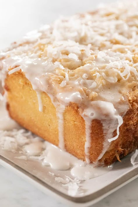 This coconut loaf cake is full of buttery, coconut flavor! It's easy to make and has a 3 ingredient homemade coconut glaze poured over the top. The perfect recipe for spring! #coconutcake @coconut #cake #recipe #spring #brunch #loaf #loafcake Coconut Glaze Icing, Coconut Loaf Cake Recipe, Easter Entertaining Ideas, Cakes For Halloween, Coconut Glaze, Coconut Loaf Cake, Coconut Loaf, Super Moist Chocolate Cake, Coconut Pound Cakes