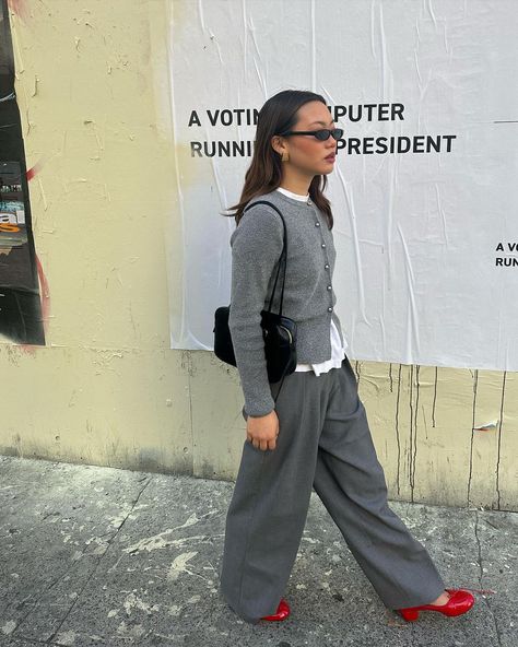 Coastal grandmother, coquette — now "eclectic grandpa" is establishing itself as the first viral trend of 2024. Here's why it's worth trying. Grey Slacks Outfit, Fashion Intern, Grey Slacks, Coastal Grandmother, Cardigan Outfits, Viral Trend, 가을 패션, Business Outfits, Red Shoes